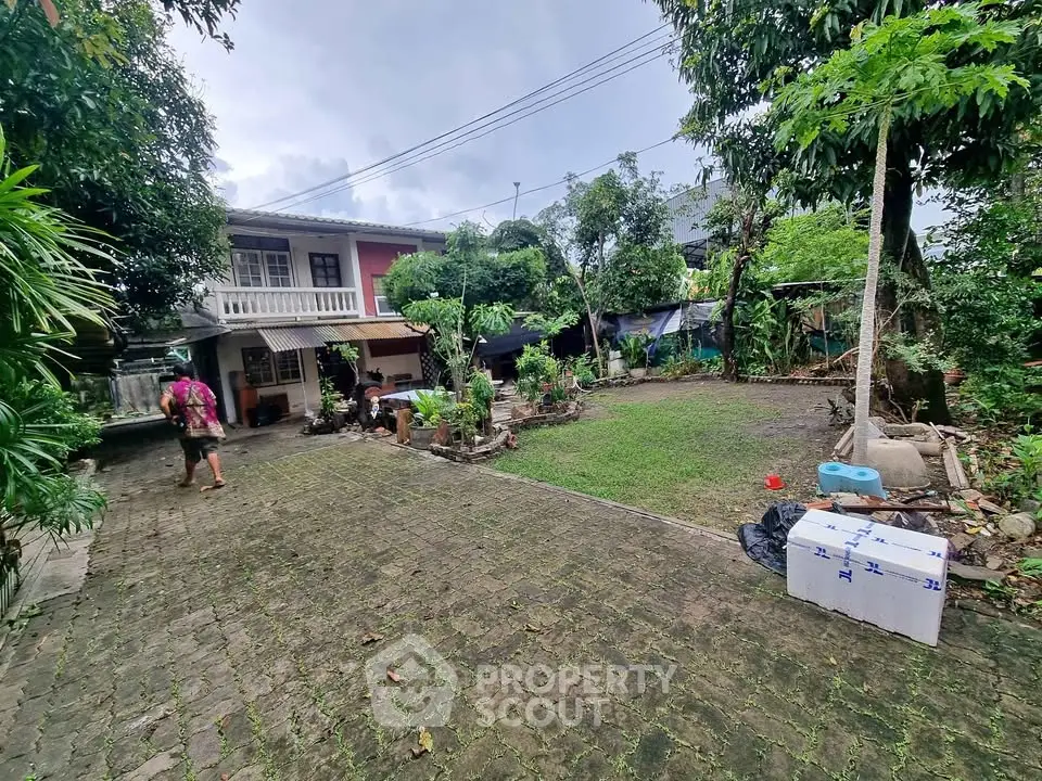 Charming suburban home with spacious garden and lush greenery, perfect for family living and outdoor activities.