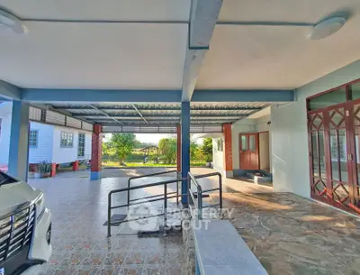 Spacious covered parking area with modern design and garden view