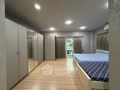 Spacious bedroom with modern design and ample storage space