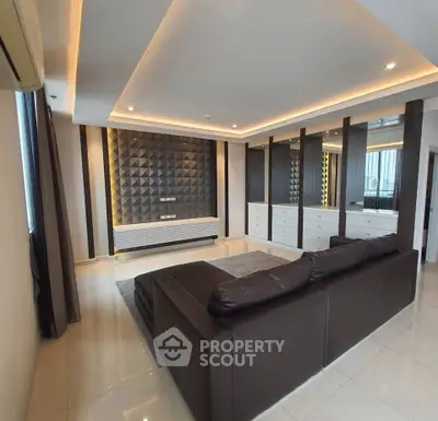 Luxurious modern living room with stylish ceiling lights and elegant leather sofa