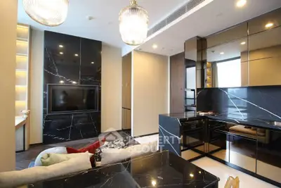 Luxurious modern living room with sleek black marble kitchen and stylish lighting fixtures.
