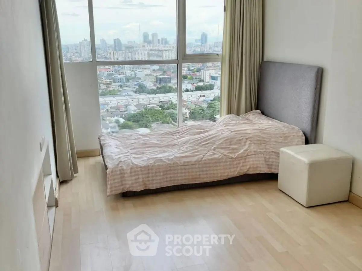 Cozy bedroom with stunning city view and natural light