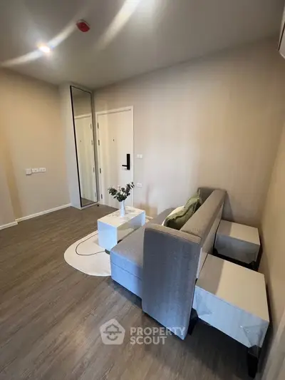 Modern living room with stylish furniture and elegant decor in a cozy apartment.