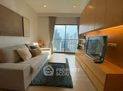 Modern living room with city view, cozy sofa, and sleek entertainment unit.
