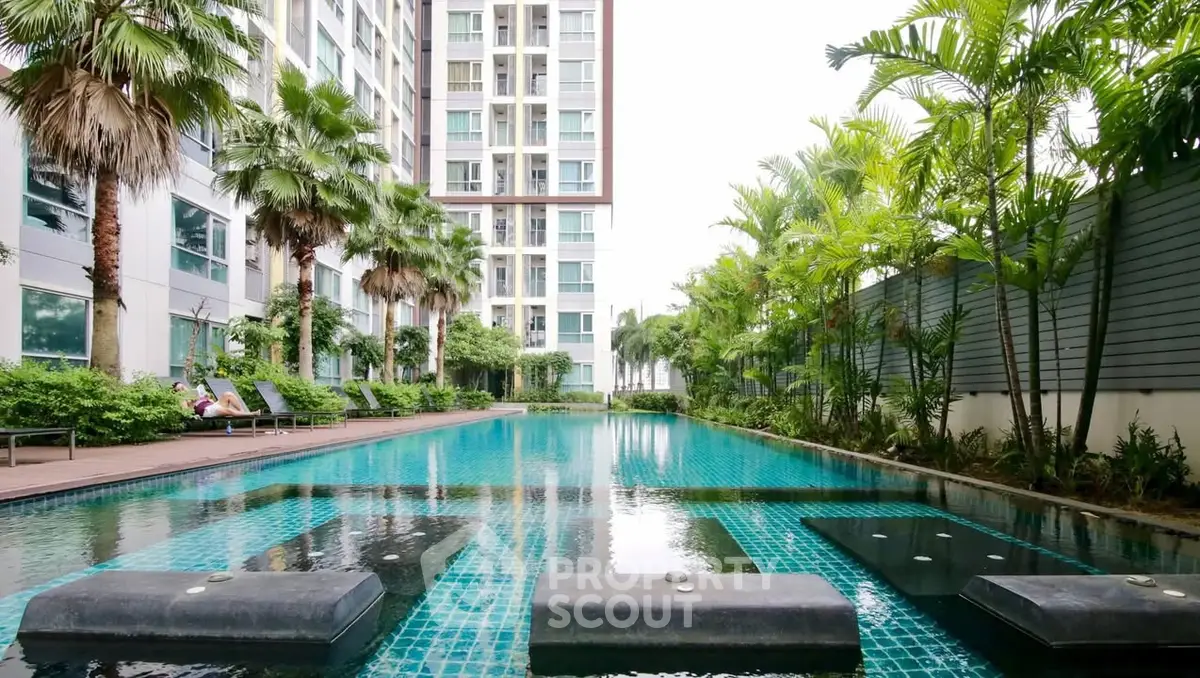 Luxurious condominium with stunning pool and lush greenery