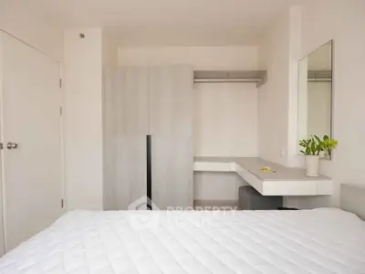 Modern bedroom with sleek wardrobe and minimalist decor