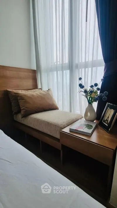 Cozy bedroom nook with natural light and elegant decor