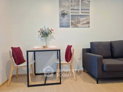 Cozy living room with modern dining set and stylish decor, perfect for intimate gatherings.