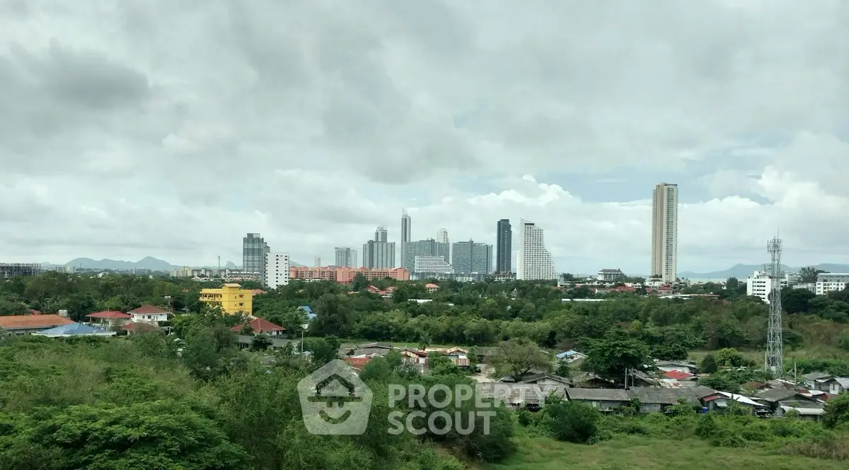 Stunning cityscape view with lush greenery and modern skyline, perfect for urban living enthusiasts.