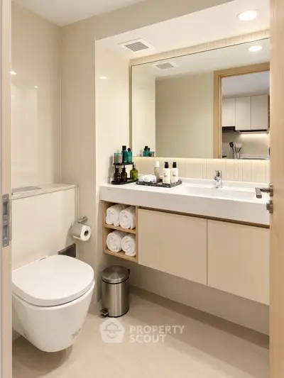 Modern bathroom with sleek fixtures and ample storage in a contemporary apartment.