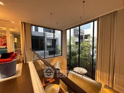 Luxurious modern living room with floor-to-ceiling windows and stylish decor