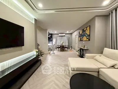Spacious modern living room with elegant decor and open layout, perfect for entertaining.