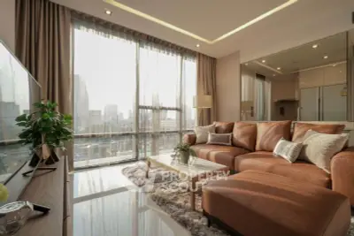 Luxurious living room with city view, modern furniture, and elegant decor in high-rise apartment.