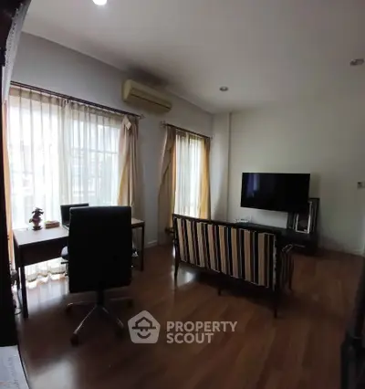 Spacious living room with modern furniture and natural light