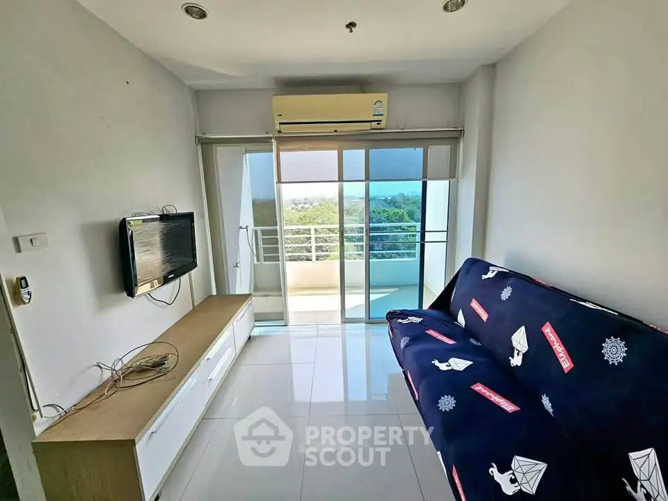 Modern living room with balcony view and sleek furnishings