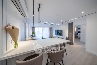 Modern open-plan living room with sleek design and elegant furnishings