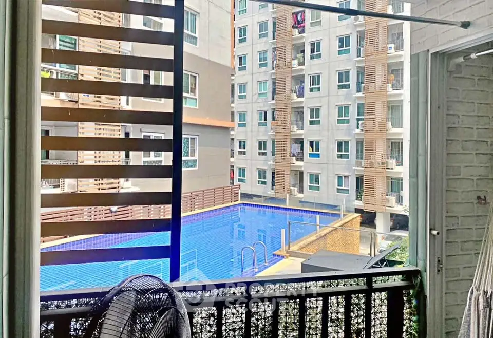 Modern apartment view with pool and balcony, perfect for urban living.