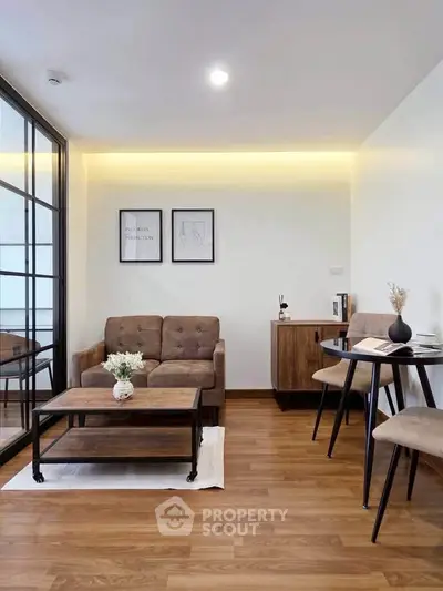 Modern living room with stylish furniture and wooden flooring