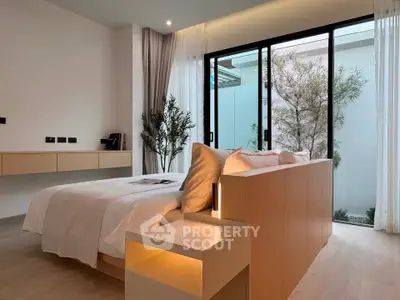 Luxurious modern bedroom with large windows and elegant decor