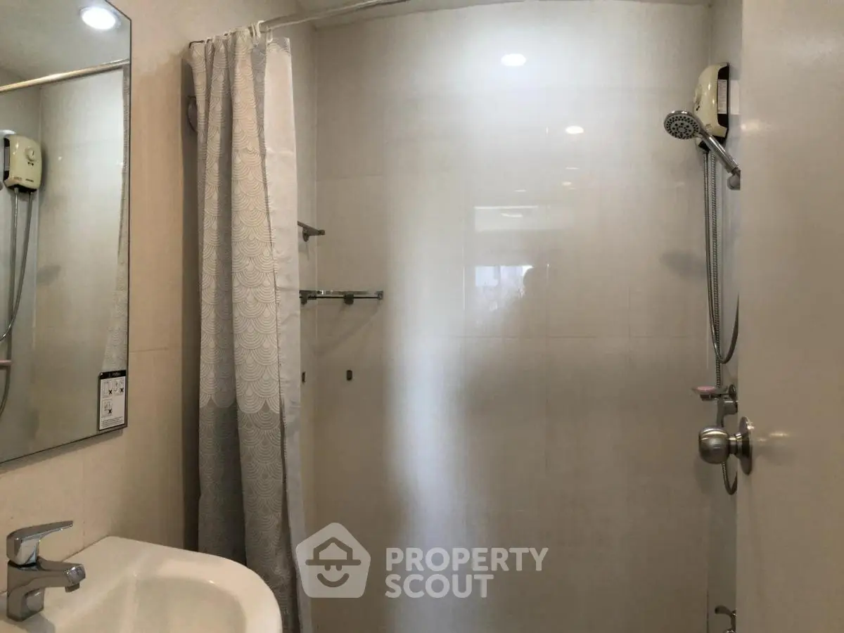 Modern bathroom with shower and sink in minimalist design