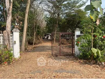 Charming rustic entrance with lush greenery and inviting pathway
