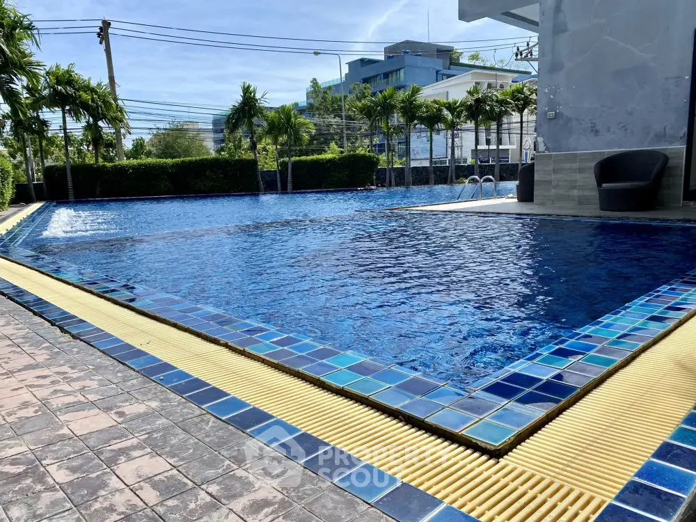 Luxurious outdoor pool area with modern design and lush greenery