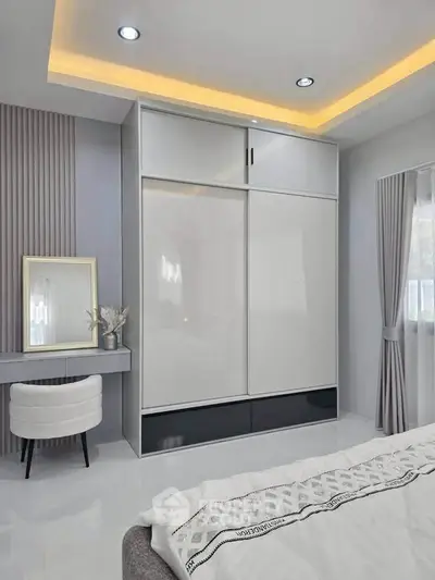 Modern bedroom with sleek wardrobe and elegant decor