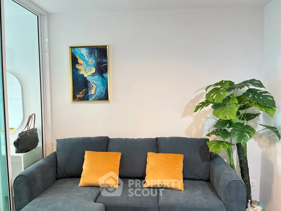Modern living room with stylish sofa and vibrant artwork