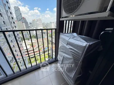 High-rise balcony with city view and air conditioning unit in modern apartment.