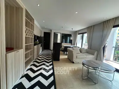 Spacious modern living room with open kitchen and stylish flooring in a bright apartment