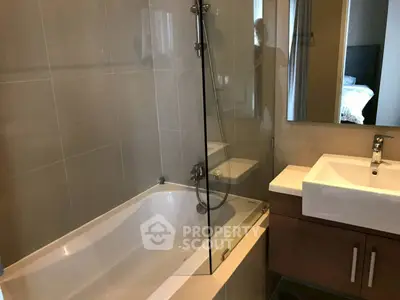 Modern bathroom with bathtub and sleek design in contemporary apartment.