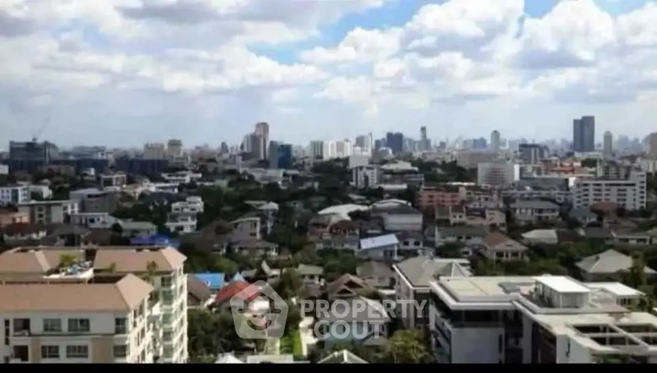 Stunning cityscape view showcasing urban skyline and residential buildings under a vibrant sky.