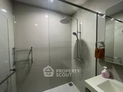 Modern bathroom with glass shower and sleek fixtures