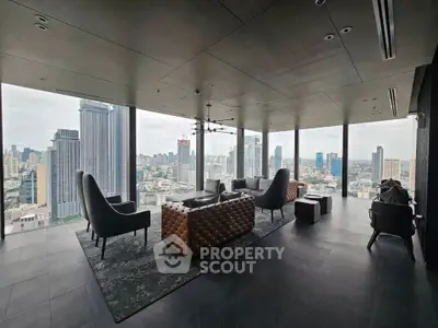 Luxurious high-rise living room with panoramic city views and modern furnishings.