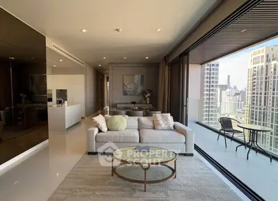 Luxurious living room with stunning city view and spacious balcony in modern apartment.