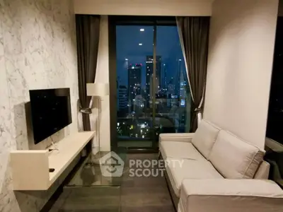 Modern living room with city view, featuring sleek furniture and floor-to-ceiling windows.