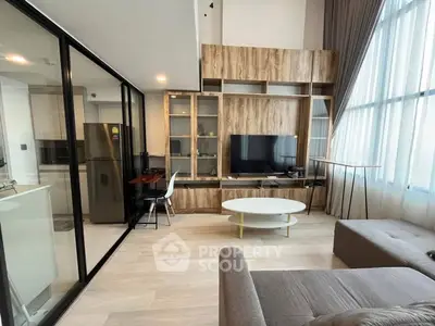 Modern living room with stylish decor and large windows for natural light
