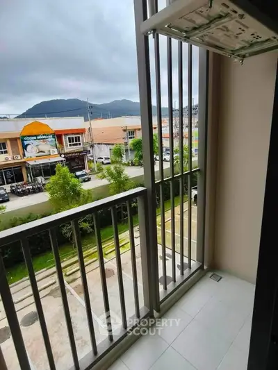 Charming balcony view with mountain backdrop, perfect for relaxation and enjoying the scenery.