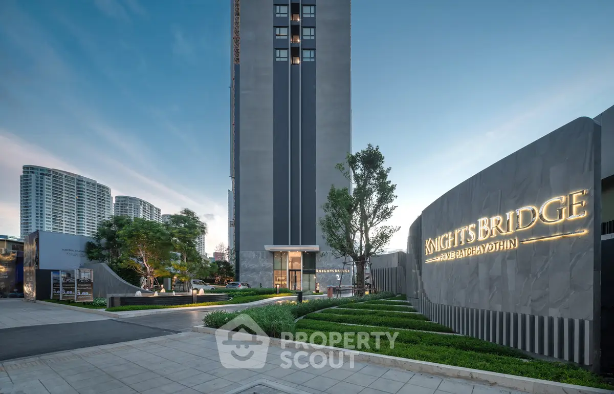 Luxurious high-rise building exterior with modern landscaping at dusk, showcasing elegant architecture.