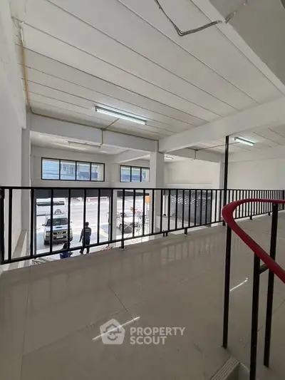 Spacious commercial property with large windows and modern design, ideal for business opportunities.