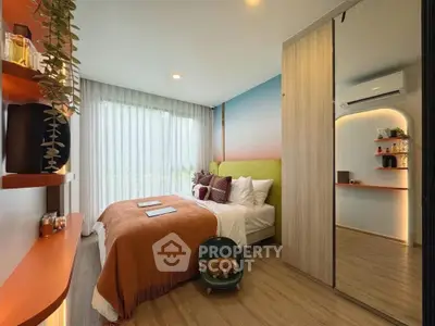 Modern bedroom with stylish decor and large window for natural light