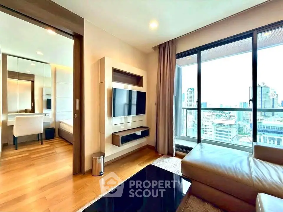 Luxurious living room with city view, modern furniture, and sleek design in high-rise apartment.