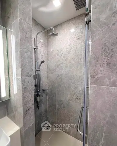 Modern bathroom with sleek shower design and elegant marble tiles