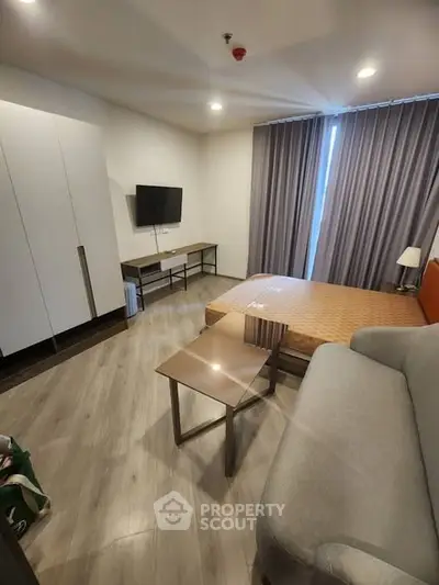 Modern bedroom with sleek furniture and natural light