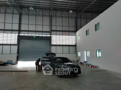 Spacious industrial warehouse with high ceilings and ample natural light