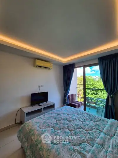 Cozy bedroom with balcony view and modern amenities