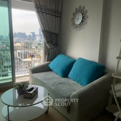 Chic living room with cozy sofa and stunning city view from balcony