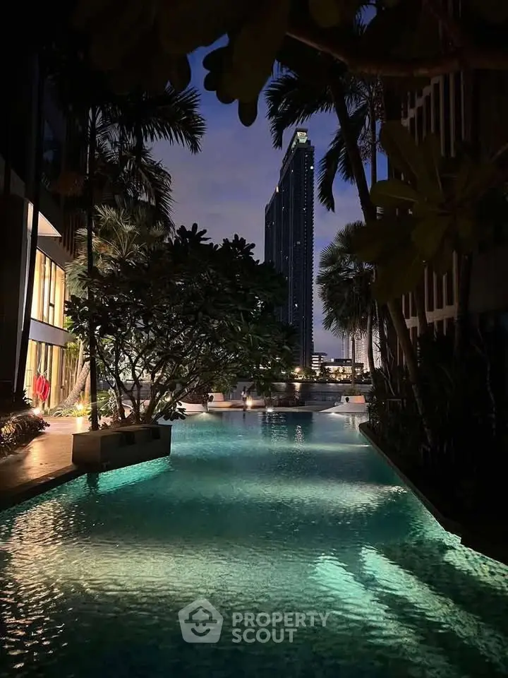 Luxurious poolside view with city skyline at dusk, perfect for urban living enthusiasts.