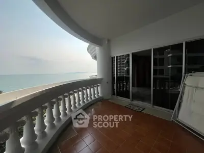 Spacious balcony with stunning ocean view and elegant railing.