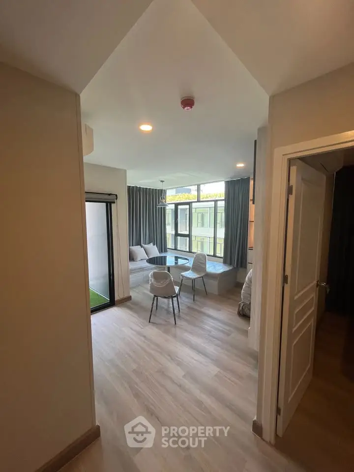 Modern living room with large windows and stylish furniture